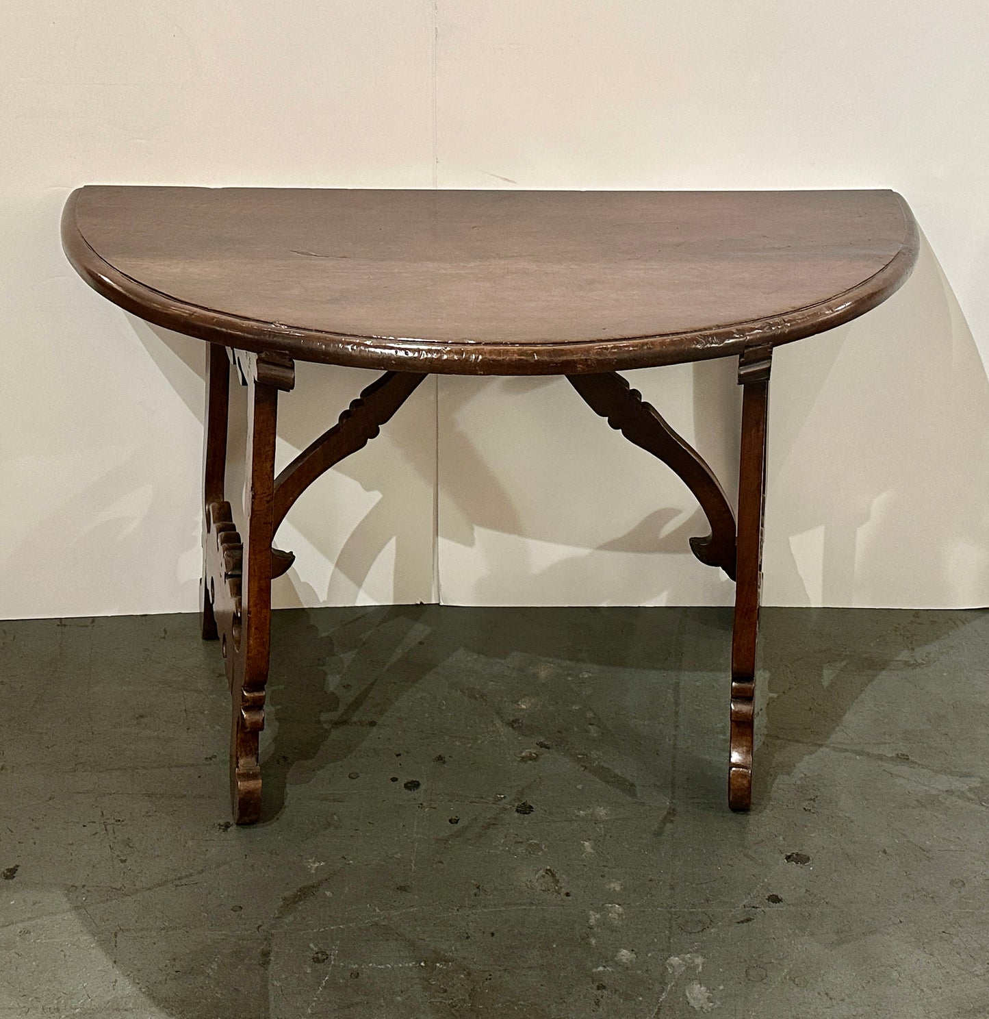 Pair of Late 1700's Walnut Trestle Leg Demi-lune Console Tables