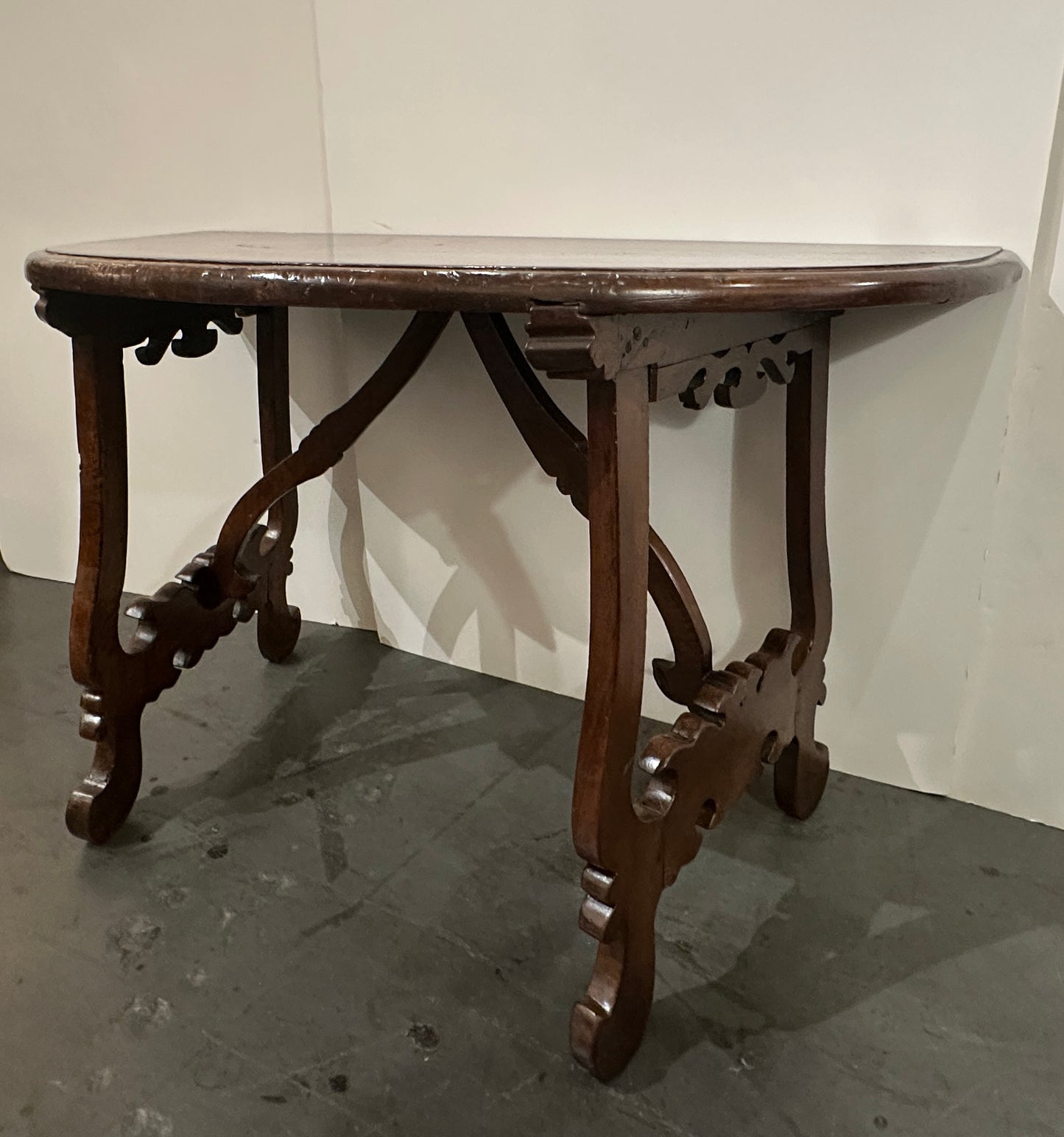 Pair of Late 1700's Walnut Trestle Leg Demi-lune Console Tables