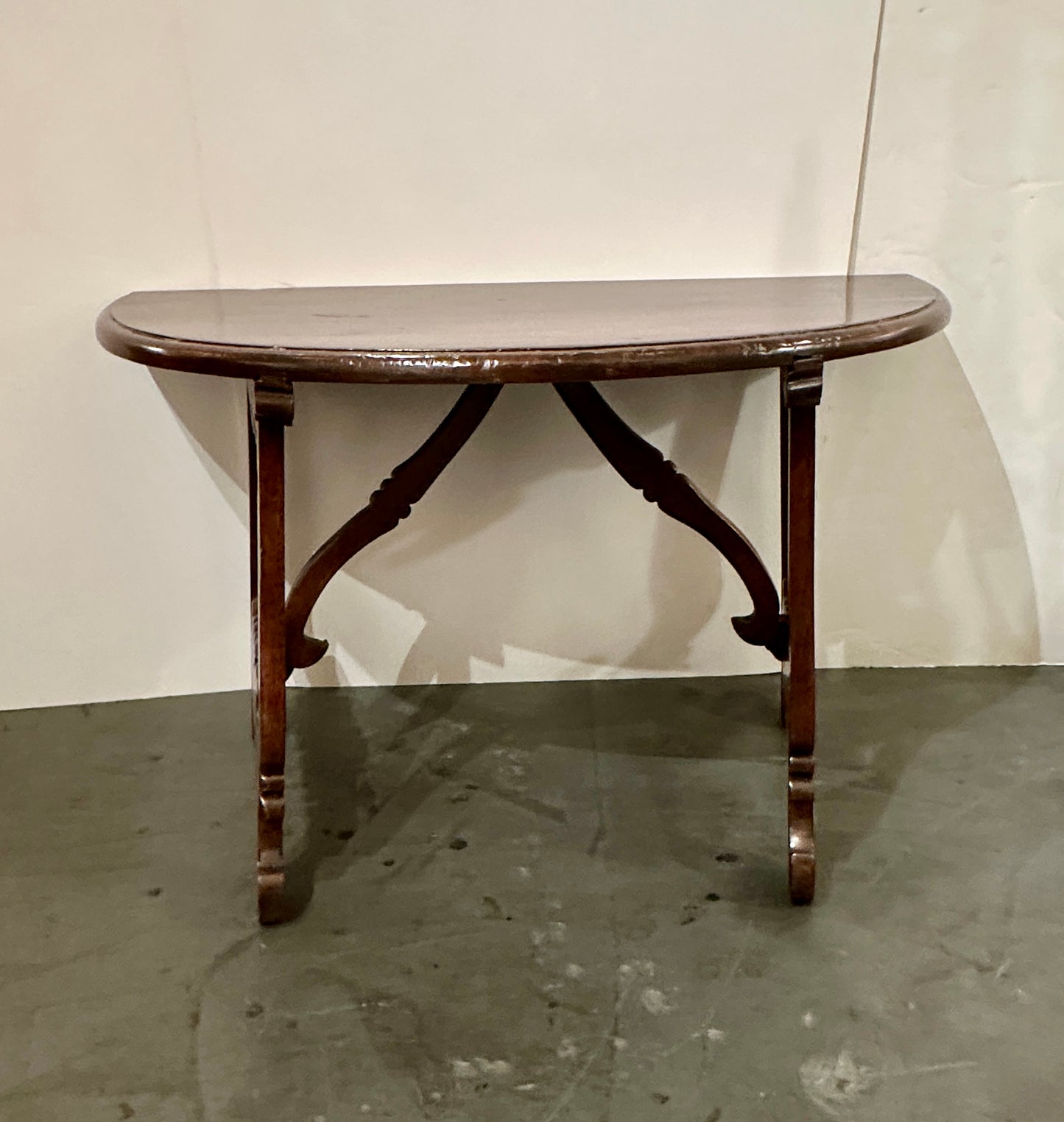 Pair of Late 1700's Walnut Trestle Leg Demi-lune Console Tables