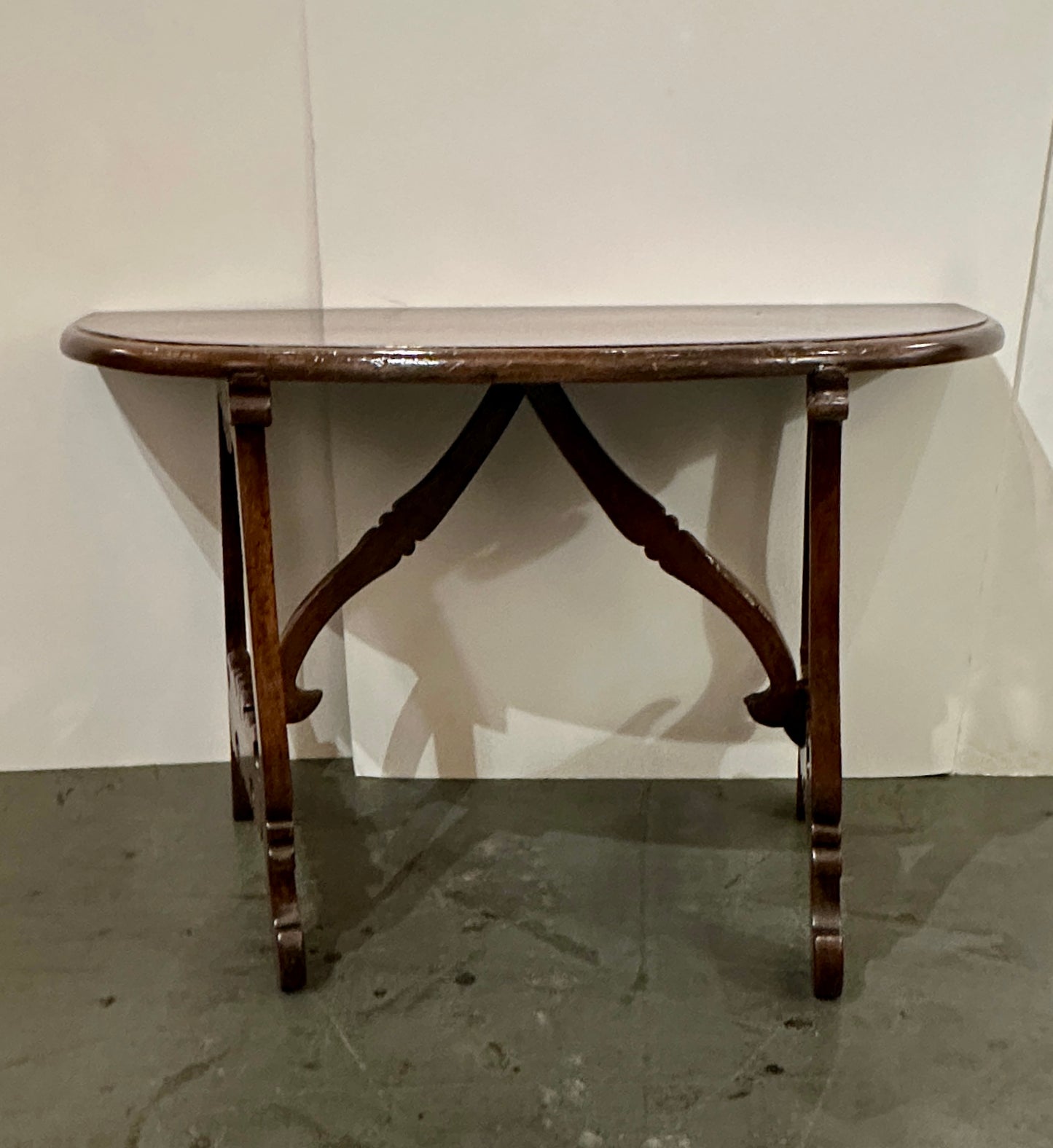 Pair of Late 1700's Walnut Trestle Leg Demi-lune Console Tables