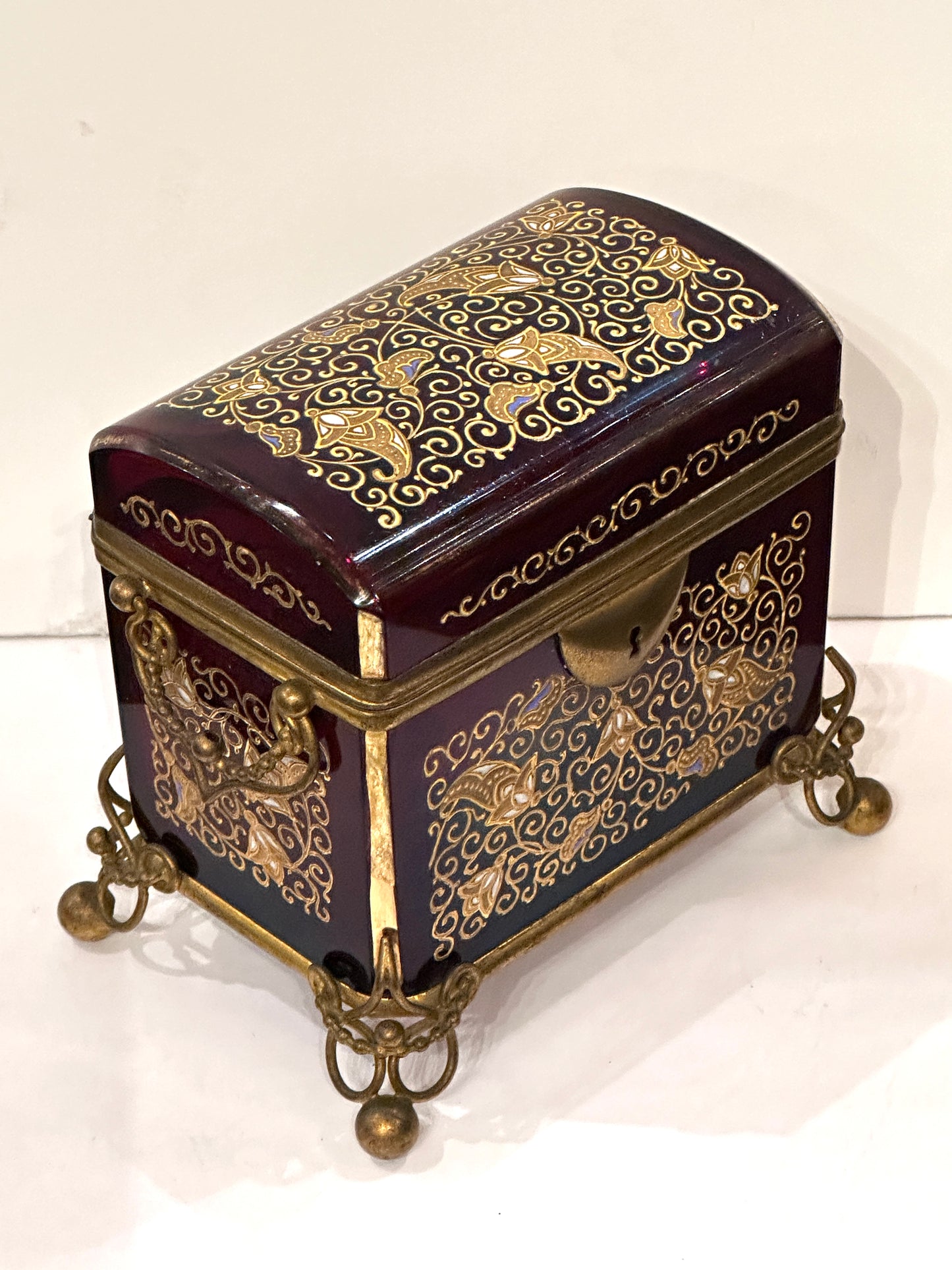 Hinged Cranberry Glass Box with Enamel Decoration and Gilded Bronze Mounts.  19th Century