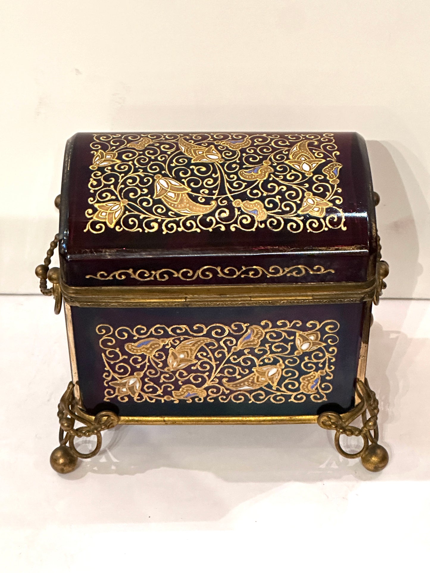 Hinged Cranberry Glass Box with Enamel Decoration and Gilded Bronze Mounts.  19th Century
